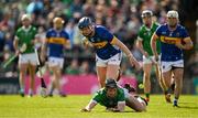 28 April 2024; Peter Casey of Limerick is tackled by Alan Tynan of Tipperary during the Munster GAA Hurling Senior Championship Round 2 match between Limerick and Tipperary at TUS Gaelic Grounds in Limerick. Photo by Brendan Moran/Sportsfile