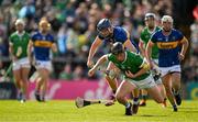 28 April 2024; Peter Casey of Limerick is tackled by Alan Tynan of Tipperary during the Munster GAA Hurling Senior Championship Round 2 match between Limerick and Tipperary at TUS Gaelic Grounds in Limerick. Photo by Brendan Moran/Sportsfile