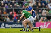 28 April 2024; Diarmaid Byrnes of Limerick in action against Noel McGrath of Tipperary during the Munster GAA Hurling Senior Championship Round 2 match between Limerick and Tipperary at TUS Gaelic Grounds in Limerick. Photo by Brendan Moran/Sportsfile