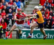 28 April 2024; Alan Connolly of Cork is tackled by Adam Hogan of Clare during the Munster GAA Hurling Senior Championship Round 2 match between Cork and Clare at SuperValu Páirc Ui Chaoimh in Cork. Photo by Ray McManus/Sportsfile