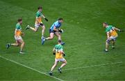 28 April 2024; Colm Basquel of Dublin in action against Offaly players, from left, Rory Egan, John Furlong, Lee Pearson, 2, and Declan Hogan during the Leinster GAA Football Senior Championship semi-final match between Dublin and Offaly at Croke Park in Dublin. Photo by Piaras Ó Mídheach/Sportsfile