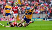 28 April 2024; Shane O'Donnell of Clare is tackled by Eoin Downey of Cork during the Munster GAA Hurling Senior Championship Round 2 match between Cork and Clare at SuperValu Páirc Ui Chaoimh in Cork. Photo by Ray McManus/Sportsfile