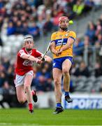 28 April 2024; Peter Duggan of Clare in action against Ethan Twomey of Cork during the Munster GAA Hurling Senior Championship Round 2 match between Cork and Clare at SuperValu Páirc Ui Chaoimh in Cork. Photo by Ray McManus/Sportsfile