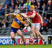 28 April 2024; Aidan McCarthy of Clare is tackled by Declan Dalton of Cork during the Munster GAA Hurling Senior Championship Round 2 match between Cork and Clare at SuperValu Páirc Ui Chaoimh in Cork. Photo by Ray McManus/Sportsfile