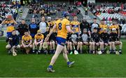 28 April 2024; David Fitzgerald of Clare arrives to take his place in the squad picture before the Munster GAA Hurling Senior Championship Round 2 match between Cork and Clare at SuperValu Páirc Ui Chaoimh in Cork. Photo by Ray McManus/Sportsfile