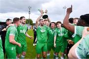 28 April 2024; Gavin Smith of Glebe North lifts the cup after the FAI Intermediate Cup Final between Glebe North FC of the Leinster Senior League and Ringmahon Rangers FC of the Munster Senior League at Weaver's Park in Drogheda, Louth. Photo by Ben McShane/Sportsfile