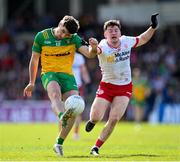 28 April 2024; Daire Ó Baoill of Donegal and Aidan Clarke of Tyrone during the Ulster GAA Football Senior Championship semi-final match between Donegal and Tyrone at Celtic Park in Derry. Photo by Stephen McCarthy/Sportsfile