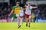 28 April 2024; Daire Ó Baoill of Donegal and Aidan Clarke of Tyrone during the Ulster GAA Football Senior Championship semi-final match between Donegal and Tyrone at Celtic Park in Derry. Photo by Stephen McCarthy/Sportsfile