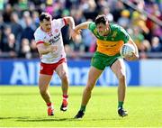 28 April 2024; Michael Langan of Donegal is tackled by Darragh Canavan of Tyrone during the Ulster GAA Football Senior Championship semi-final match between Donegal and Tyrone at Celtic Park in Derry. Photo by Stephen McCarthy/Sportsfile