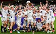 28 April 2024; Cork Constitution captain David Hyland lifts the trophy and celebrates with teammates after their side's victory in the Energia All-Ireland League Men's Division 1A final match between Terenure College and Cork Constitution at the Aviva Stadium in Dublin. Photo by Seb Daly/Sportsfile