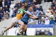 28 April 2024; Colm Basquel of Dublin is tackled by Dylan Hyland of Offaly during the Leinster GAA Football Senior Championship semi-final match between Dublin and Offaly at Croke Park in Dublin. Photo by Shauna Clinton/Sportsfile