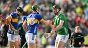 28 April 2024; Noel McGrath of Tipperary, left, and Diarmaid Byrnes of Limerick after the final whistle of the Munster GAA Hurling Senior Championship Round 2 match between Limerick and Tipperary at TUS Gaelic Grounds in Limerick. Photo by Brendan Moran/Sportsfile