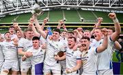 28 April 2024; Cork Constitution captain David Hyland lifts the trophy and celebrates with teammates after their side's victory in the Energia All-Ireland League Men's Division 1A final match between Terenure College and Cork Constitution at the Aviva Stadium in Dublin. Photo by Seb Daly/Sportsfile