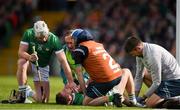 28 April 2024; Cian Lynch of Limerick with teammate Peter Casey being tended to by medical staff after picking up an injury while scoring his sides second goal during the Munster GAA Hurling Senior Championship Round 2 match between Limerick and Tipperary at TUS Gaelic Grounds in Limerick. Photo by Tom Beary/Sportsfile