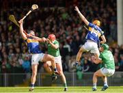 28 April 2024; Tipperary players, from left, Jason Forde and Mark Kehoe, compete for a high ball with Limerick players, from left, Barry Nash and Sean Finn of Limerick during the Munster GAA Hurling Senior Championship Round 2 match between Limerick and Tipperary at TUS Gaelic Grounds in Limerick. Photo by Tom Beary/Sportsfile