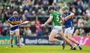 28 April 2024; Diarmaid Byrnes of Limerick holds off Noel McGrath of Tipperary during the Munster GAA Hurling Senior Championship Round 2 match between Limerick and Tipperary at TUS Gaelic Grounds in Limerick. Photo by Brendan Moran/Sportsfile