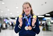 28 April 2024; Roisin Ni Riain poses with her gold medal from the Women's 100m Breaststroke SB13, gold medal from the Women's 100m Backstroke S13, silver medal from the Women's 100m Butterfly S13, silver medal from the Women's 200m Individual Medley SM13 and bronze medal from the Women's 400m Freestyle S13 at Dublin Airport as the Irish Para Swimming Team return home from the Para Swimming European Championships in Portugal. Photo by Ben McShane/Sportsfile