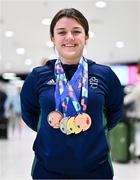 28 April 2024; Nicole Turner poses with her gold medal from the Women's 50m Freestyle S6, silver medal from the Women's 50m Butterfly S6, bronze medal from the Women's 200m Individual Medley SM6 and bronze medal from the Women's 100m Breaststroke SB6 at Dublin Airport as the Irish Para Swimming Team return home from the Para Swimming European Championships in Portugal. Photo by Ben McShane/Sportsfile