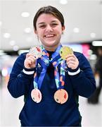 28 April 2024; Nicole Turner poses with her gold medal from the Women's 50m Freestyle S6, silver medal from the Women's 50m Butterfly S6, bronze medal from the Women's 200m Individual Medley SM6 and bronze medal from the Women's 100m Breaststroke SB6 at Dublin Airport as the Irish Para Swimming Team return home from the Para Swimming European Championships in Portugal. Photo by Ben McShane/Sportsfile