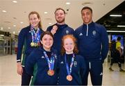 28 April 2024; Irish Para Swim team, top row from left, Roisin Ni Riain, Barry McClements and Deaten Registe, with front row, from left, Nicole Turner and Dearbhaile Brady pose at Dublin Airport as the Irish Para Swimming Team return home from the Para Swimming European Championships in Portugal. Photo by Ben McShane/Sportsfile