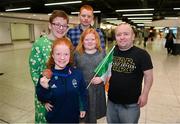 28 April 2024; Bronze medallist Dearbhaile Brady with her family, from left, her mother Brigid, her brother Matthew, age 14, her sister Sarah, age 10 and her father John at Dublin Airport as the Irish Para Swimming Team return home from the Para Swimming European Championships in Portugal. Photo by Ben McShane/Sportsfile