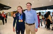 28 April 2024; Roisin Ni Riain with her father Seosamh at Dublin Airport as the Irish Para Swimming Team return home from the Para Swimming European Championships in Portugal. Photo by Ben McShane/Sportsfile