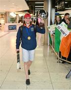 28 April 2024; Raymond Karpinsci celebrates with the IIHF Development cup on arrival to Dublin Airport as the Ireland Hockey team arrive after their victory in the 2024 IIHF Development Cup in Bratislava, Slovakia. Photo by Ben McShane/Sportsfile