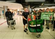 28 April 2024; Assistant coach Paul Cummins, right, and head coach Aaron Guli at Dublin Airport as the Ireland Hockey team arrive after their victory in the 2024 IIHF Development Cup in Bratislava, Slovakia. Photo by Ben McShane/Sportsfile