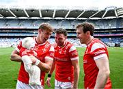 28 April 2024; Conor Grimes of Louth with his 7 week old daughter Izzy and team-mates Sam Mulroy, centre, and Bevan Duffy, right, after victory in the Leinster GAA Football Senior Championship semi-final match between Kildare and Louth at Croke Park in Dublin. Photo by Piaras Ó Mídheach/Sportsfile