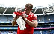 28 April 2024; Conor Grimes of Louth with his 7 week old daughter Izzy after victory in the Leinster GAA Football Senior Championship semi-final match between Kildare and Louth at Croke Park in Dublin. Photo by Piaras Ó Mídheach/Sportsfile