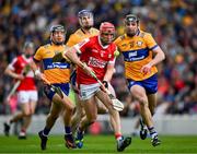 28 April 2024; Ciaran Joyce of Cork with Clare players, from left, David Reidy, left, David Fitzgerald and Cathal Malone, right, in persuit during the Munster GAA Hurling Senior Championship Round 2 match between Cork and Clare at SuperValu Páirc Ui Chaoimh in Cork. Photo by Ray McManus/Sportsfile
