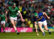 28 April 2024; Noel McGrath of Tipperary in action against William O'Donoghue of Limerick during the Munster GAA Hurling Senior Championship Round 2 match between Limerick and Tipperary at TUS Gaelic Grounds in Limerick. Photo by Tom Beary/Sportsfile