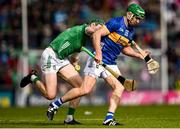 28 April 2024; Noel McGrath of Tipperary is tackled by William O'Donoghue of Limerick during the Munster GAA Hurling Senior Championship Round 2 match between Limerick and Tipperary at TUS Gaelic Grounds in Limerick. Photo by Tom Beary/Sportsfile