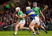 28 April 2024; Aaron Gillane of Limerick in action against Bryan O'Mara of Tipperary during the Munster GAA Hurling Senior Championship Round 2 match between Limerick and Tipperary at TUS Gaelic Grounds in Limerick. Photo by Tom Beary/Sportsfile