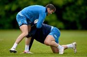 29 April 2024; Ross Byrne is tackled by James Lowe during Leinster rugby squad training at UCD in Dublin. Photo by Brendan Moran/Sportsfile