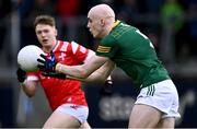 29 April 2024; Eamonn Armstrong of Meath in action against Liam Flynn of Louth during the EirGrid Leinster GAA Football U20 Championship Final match between Meath and Louth at Parnell Park in Dublin. Photo by Piaras Ó Mídheach/Sportsfile