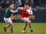 29 April 2024; Aaron McGlew of Louth in action against Hughie Corcoran of Meath during the EirGrid Leinster GAA Football U20 Championship Final match between Meath and Louth at Parnell Park in Dublin. Photo by Piaras Ó Mídheach/Sportsfile