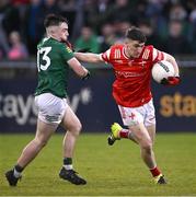 29 April 2024; Aaron McGlew of Louth in action against Hughie Corcoran of Meath during the EirGrid Leinster GAA Football U20 Championship Final match between Meath and Louth at Parnell Park in Dublin. Photo by Piaras Ó Mídheach/Sportsfile