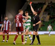 29 April 2024; Jack Keaney of Drogheda United is shown a red card by referee Rob Hennessy during the SSE Airtricity Men's Premier Division match between Shamrock Rovers and Drogheda United at Tallaght Stadium in Dublin. Photo by Stephen McCarthy/Sportsfile
