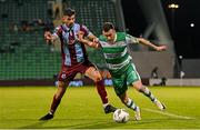 29 April 2024; Aaron Greene of Shamrock Rovers in action against Adam Foley of Drogheda United during the SSE Airtricity Men's Premier Division match between Shamrock Rovers and Drogheda United at Tallaght Stadium in Dublin. Photo by Stephen McCarthy/Sportsfile