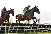 30 April 2024; Mystical Power, with Mark Walsh up, jumps the last ahead of Fascile Mode, with Sean Flanagan up, on the first time round on their way to winning the KPMG Champion Novice Hurdle during day one of the Punchestown Festival at Punchestown Racecourse in Kildare. Photo by David Fitzgerald/Sportsfile