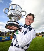 30 April 2024; JJ Slevin celebrates with the trophy after winning the William Hill Champion Steeplechase on Banbridge during day one of the Punchestown Festival at Punchestown Racecourse in Kildare.