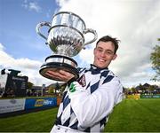 30 April 2024; JJ Slevin celebrates with the trophy after winning the William Hill Champion Steeplechase on Banbridge during day one of the Punchestown Festival at Punchestown Racecourse in Kildare.