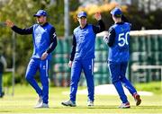 1 May 2024; Séamus Lynch of Leinster Lightning, centre, celebrates with team-mate George Dockrell, right, after catching out Brandon Kruger of Munster Reds, not pictured, during the Cricket Ireland Inter-Provincial Trophy match between Leinster Lightning and Munster Reds at Pembroke Cricket Club in Dublin. Photo by Tyler Miller/Sportsfile