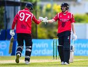 1 May 2024; John McNally of Munster Reds, left, and team-mate Gareth Delaney during the Cricket Ireland Inter-Provincial Trophy match between Leinster Lightning and Munster Reds at Pembroke Cricket Club in Dublin. Photo by Tyler Miller/Sportsfile