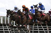 1 May 2024; Runners and riders, from left, Smooth Scotch, with Liam Quinlan up, Joyau De Thaix, with Shane O'Callaghan up, and Baltic Bird, with Oakley Brown up, jump the second during the Adare Manor Opportunity Series Final Handicap Hurdle during day two of the Punchestown Festival at Punchestown Racecourse in Kildare. Photo by Seb Daly/Sportsfile
