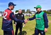 1 May 2024; Northern Knights captain Mark Adair, left, shakes hands with North West Warriors captain Andy McBrine before the Cricket Ireland Inter-Provincial Trophy match between Northern Knights and North West Warriors at Pembroke Cricket Club in Dublin. Photo by Tyler Miller/Sportsfile