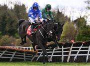 1 May 2024; Backtonormal, left, with Sean Flanagan up, jumps the last on their way to winning the Connolly's RED MILLS Irish EBF Auction Hurdle Series Final, from eventual fourth place Blizzard Of Oz, right, with Paul Townend up, during day two of the Punchestown Festival at Punchestown Racecourse in Kildare. Photo by Seb Daly/Sportsfile