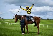 1 May 2024; Paul Townend celebrates on Dancing City with groom Brid O'Keeffe after winning the Channor Real Estate Group Novice Hurdle during day two of the Punchestown Festival at Punchestown Racecourse in Kildare. Photo by David Fitzgerald/Sportsfile