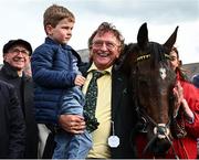 1 May 2024; Owner Sean Mulryan, with his grandson Sean, after sending out Fastorslow to win the Ladbrokes Punchestown Gold Cup during day two of the Punchestown Festival at Punchestown Racecourse in Kildare. Photo by Seb Daly/Sportsfile